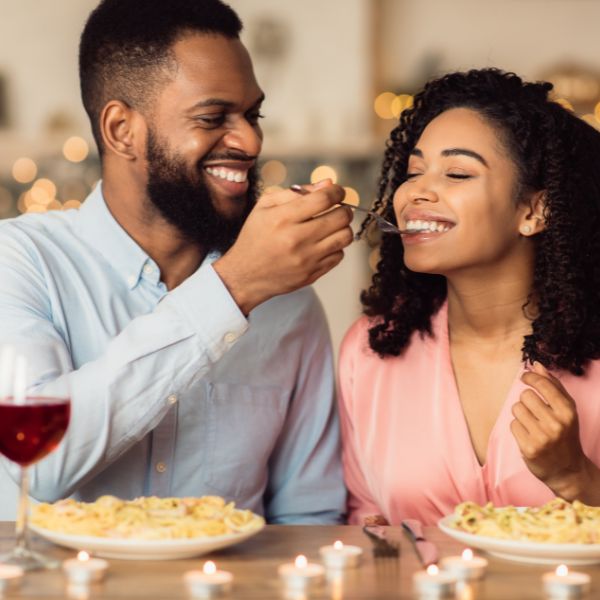 adults eating and smiling